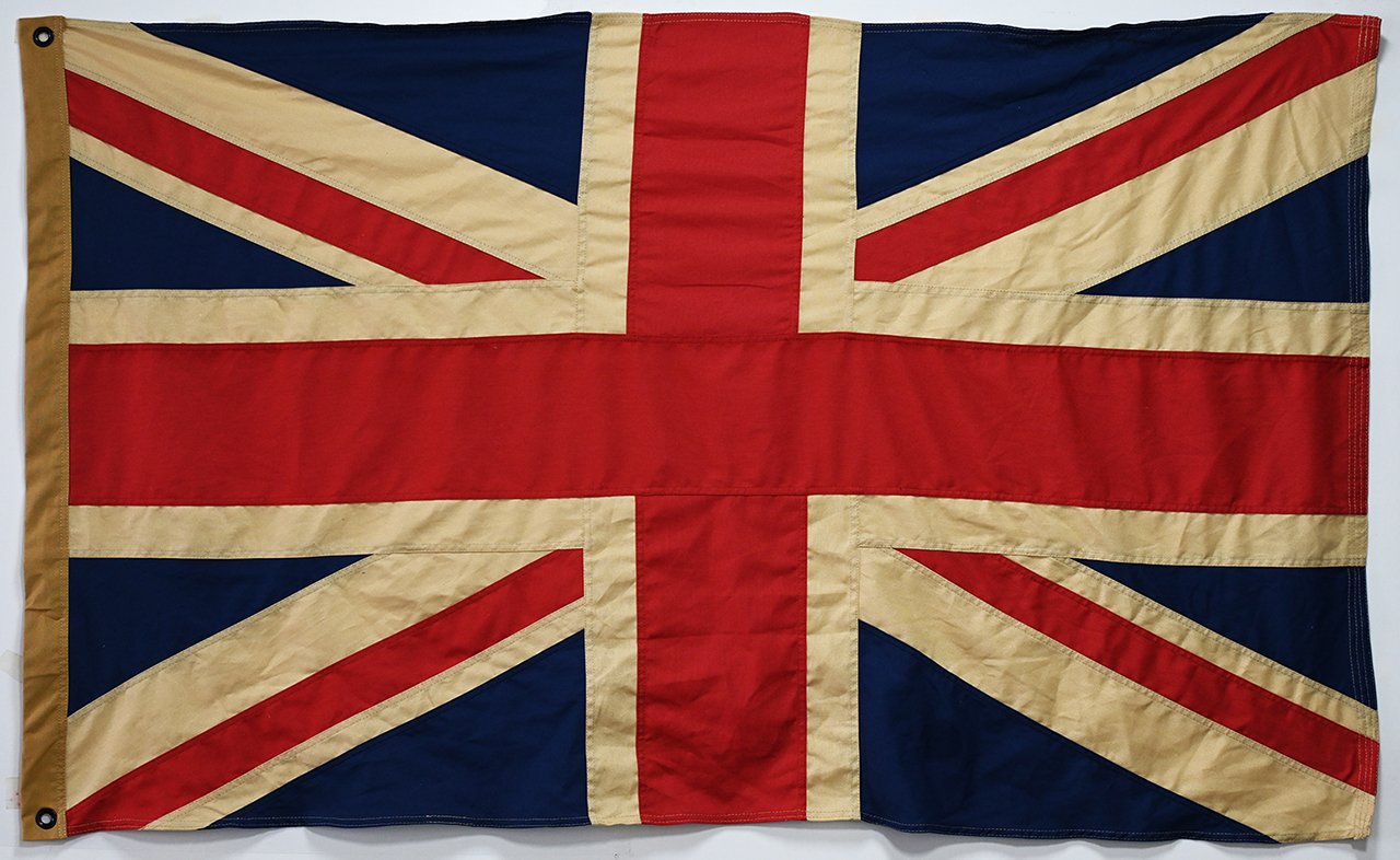 Comparison of a frayed nylon flag vs. a pristine 420D polyester flag after 6 months of outdoor use